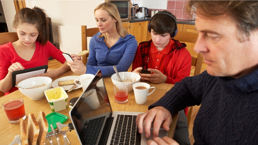 family on gadgets istock.jpg